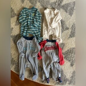 Premature onesies. Worn a few times! All double zipper